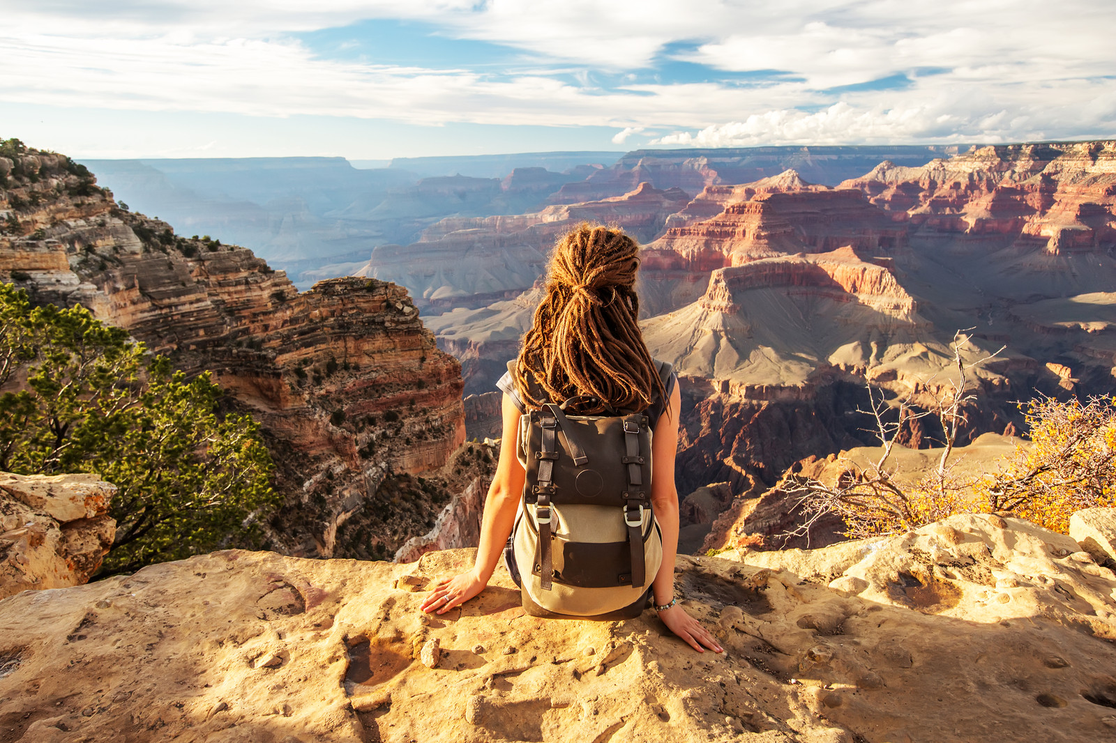 a hiker admiring the view a the Grand Canyon