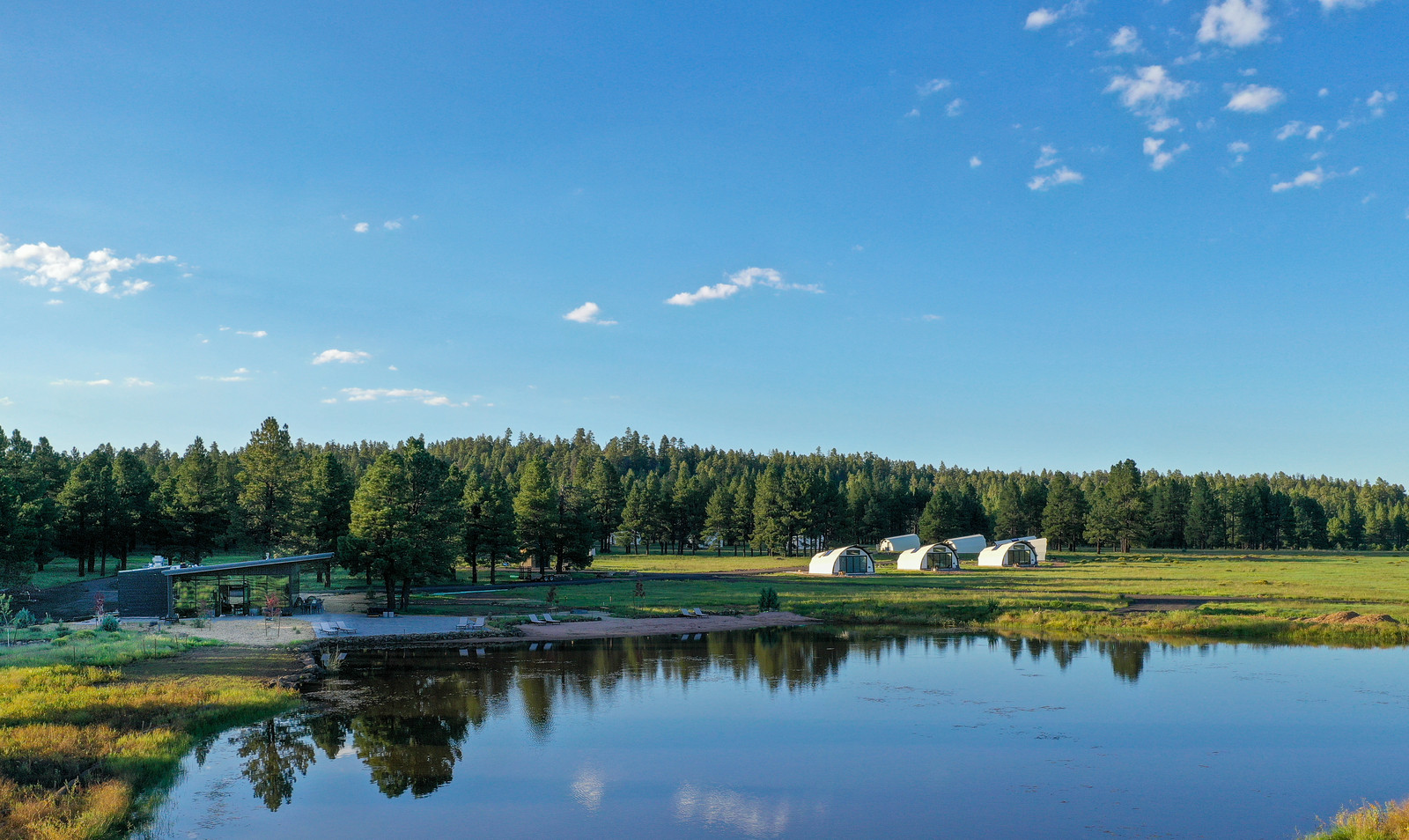 Beautiful view of the pond and tents and Backland