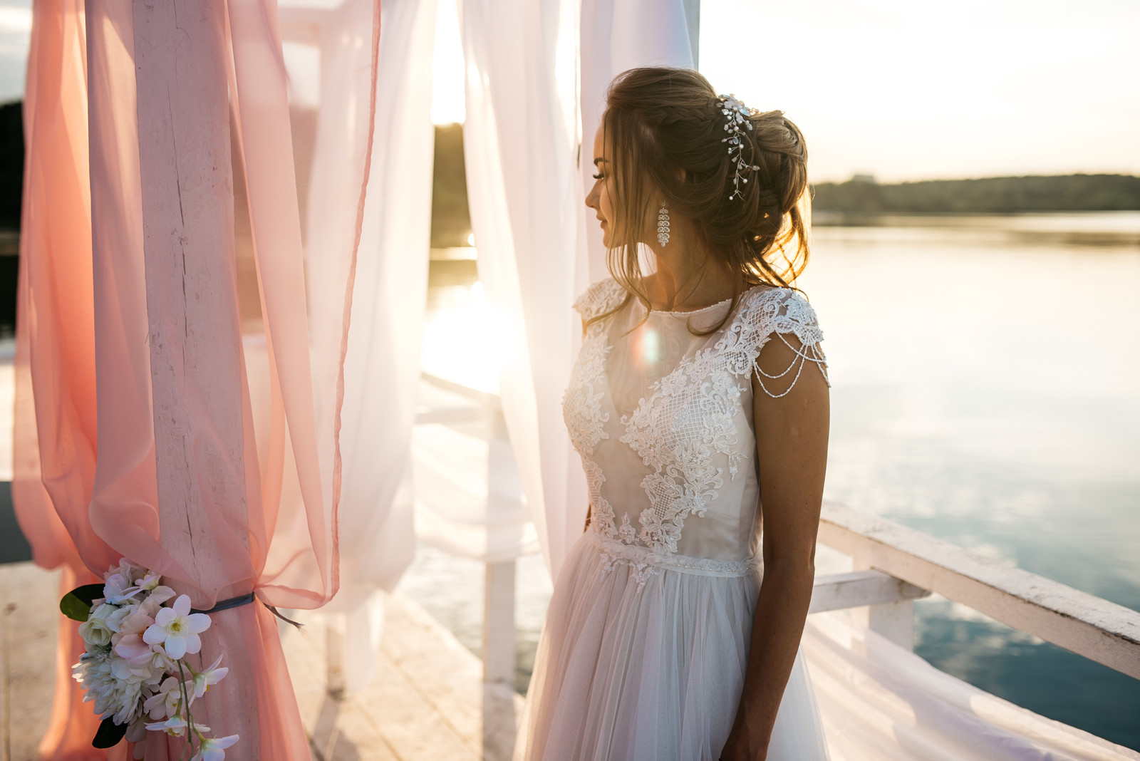 bride in a dress by a pond